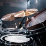 brown and white drum set