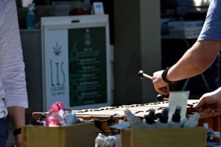 person holding gray and black chess piece