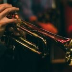 person playing trumpet during night time