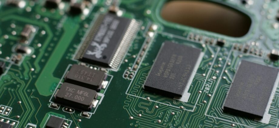 a close up of a circuit board with many chip pieces