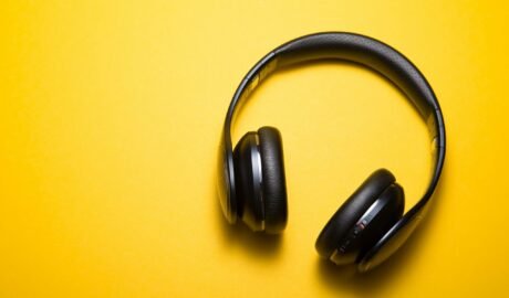 flatlay photography of wireless headphones