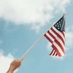 person holding U.S.A. flag